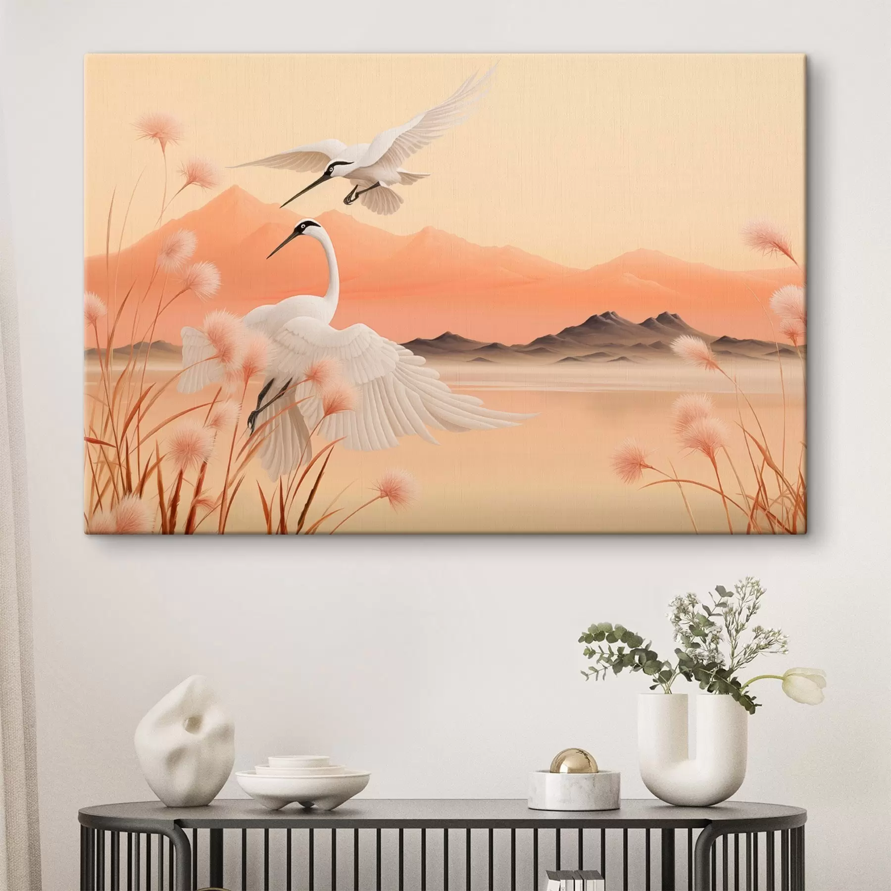 Wandbilder Weiße Kraniche mit rosa Schilf im Vordergrund, Berge und ein See im Hintergrund, weiches orangefarbenes Licht s44925